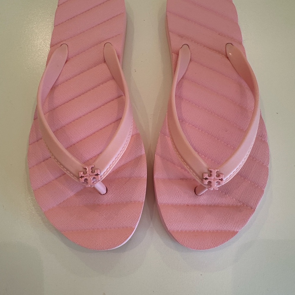 New Pink Flip Flops with Logo. Size 7M.
